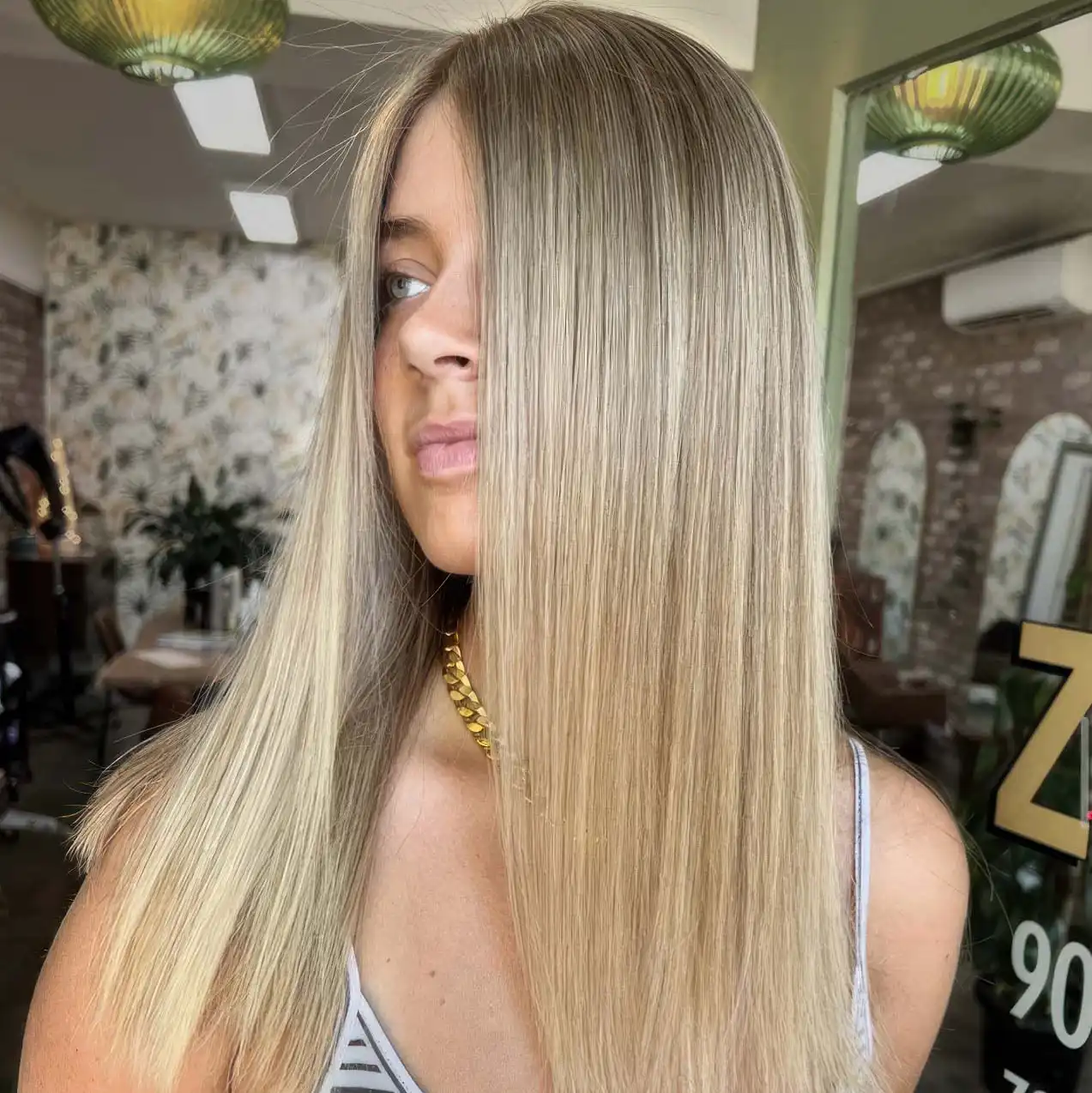 Smooth shiny hair after Nanoplasty treatment at ZAYN Salon